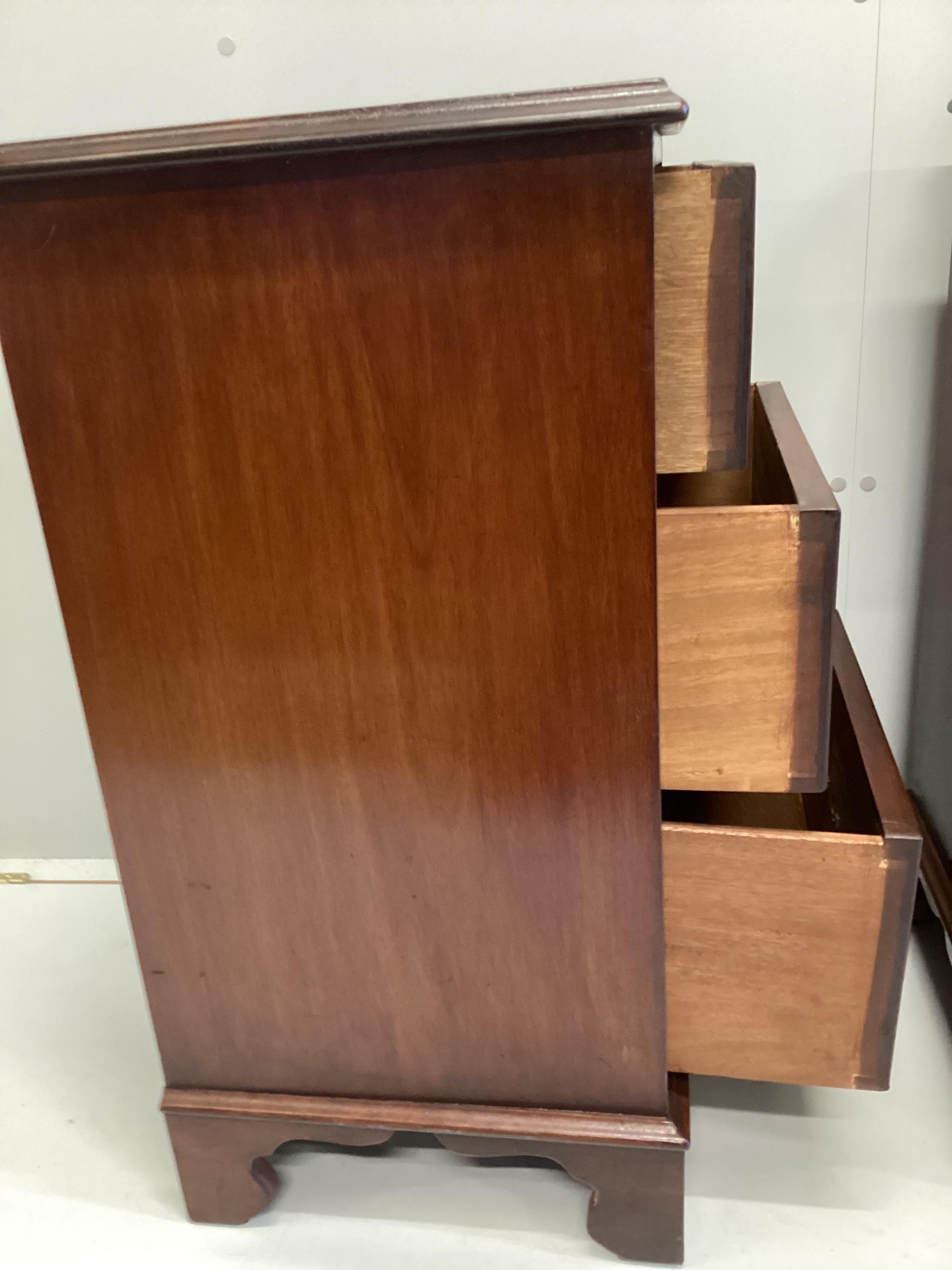 A pair of George III style mahogany three drawer bedside chests, width 47cm, depth 40cm, height 80cm
